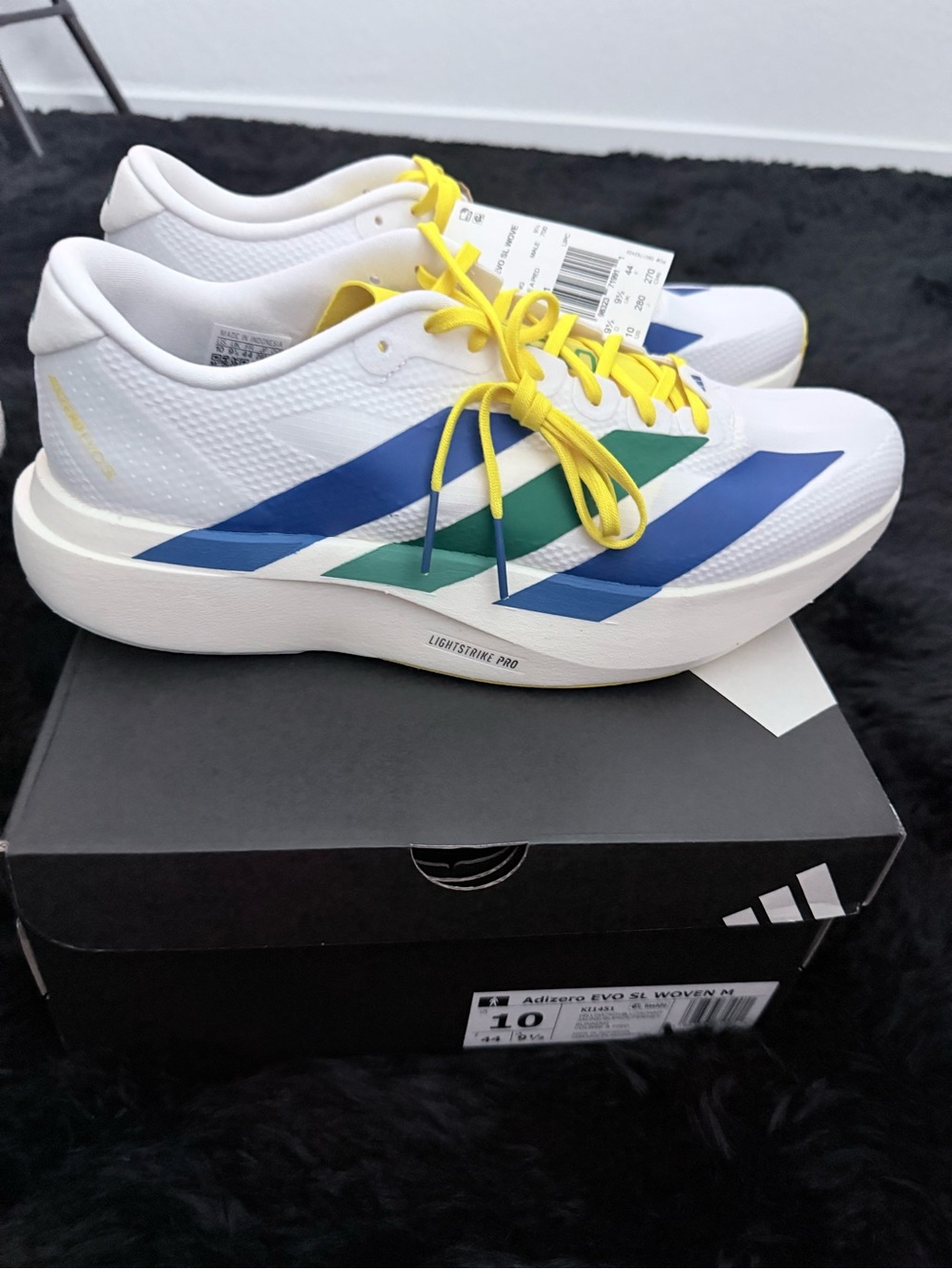 adidas Adizero Men’s White Running Shoes with Blue, Green & Yellow Accents